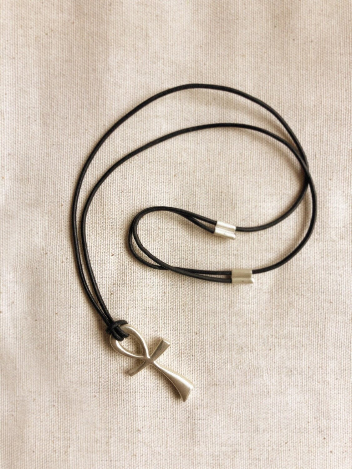 Happy Ankh Sterling Silver neckcord on leather.