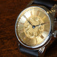 RPaige Wrocket Hand engraved gold dial watch