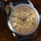 RPaige Wrocket Hand engraved gold dial watch